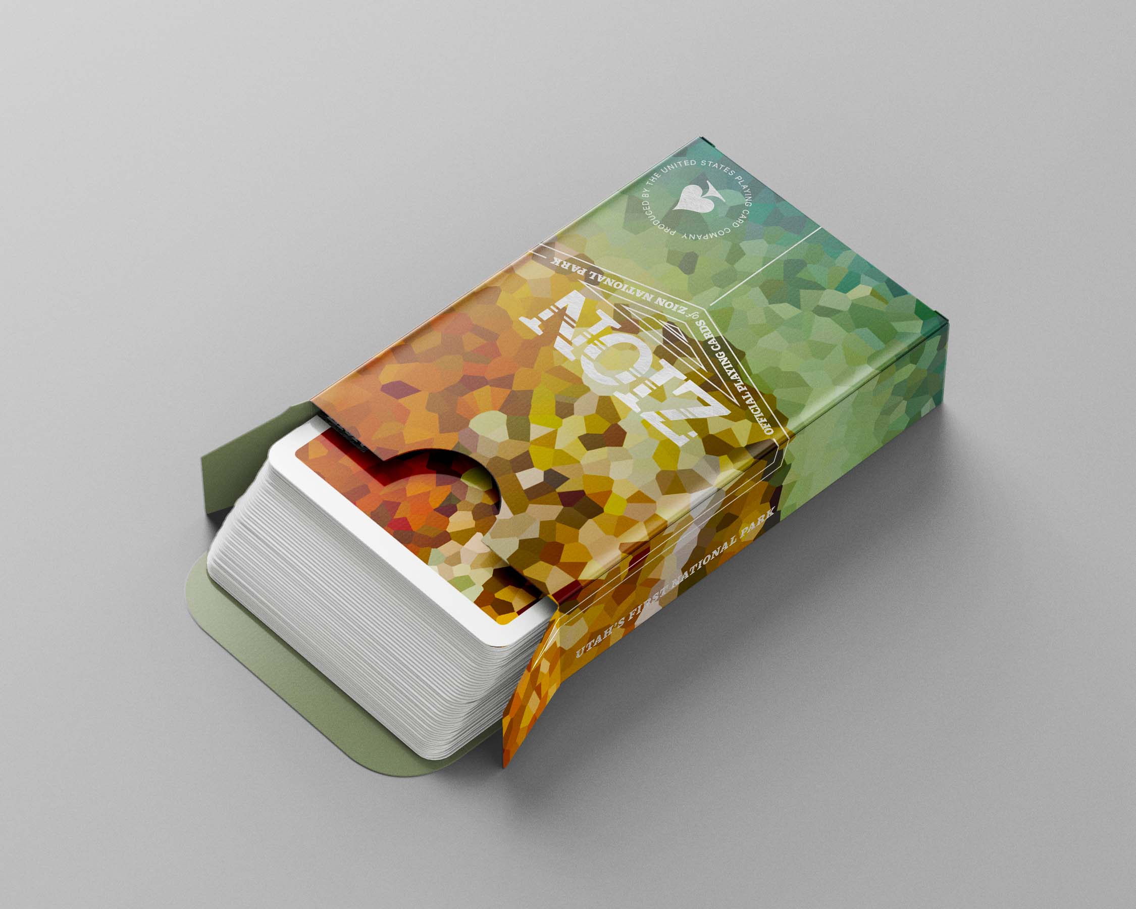 An opened box of cards, with the cards sliding out to reveal their matching design.